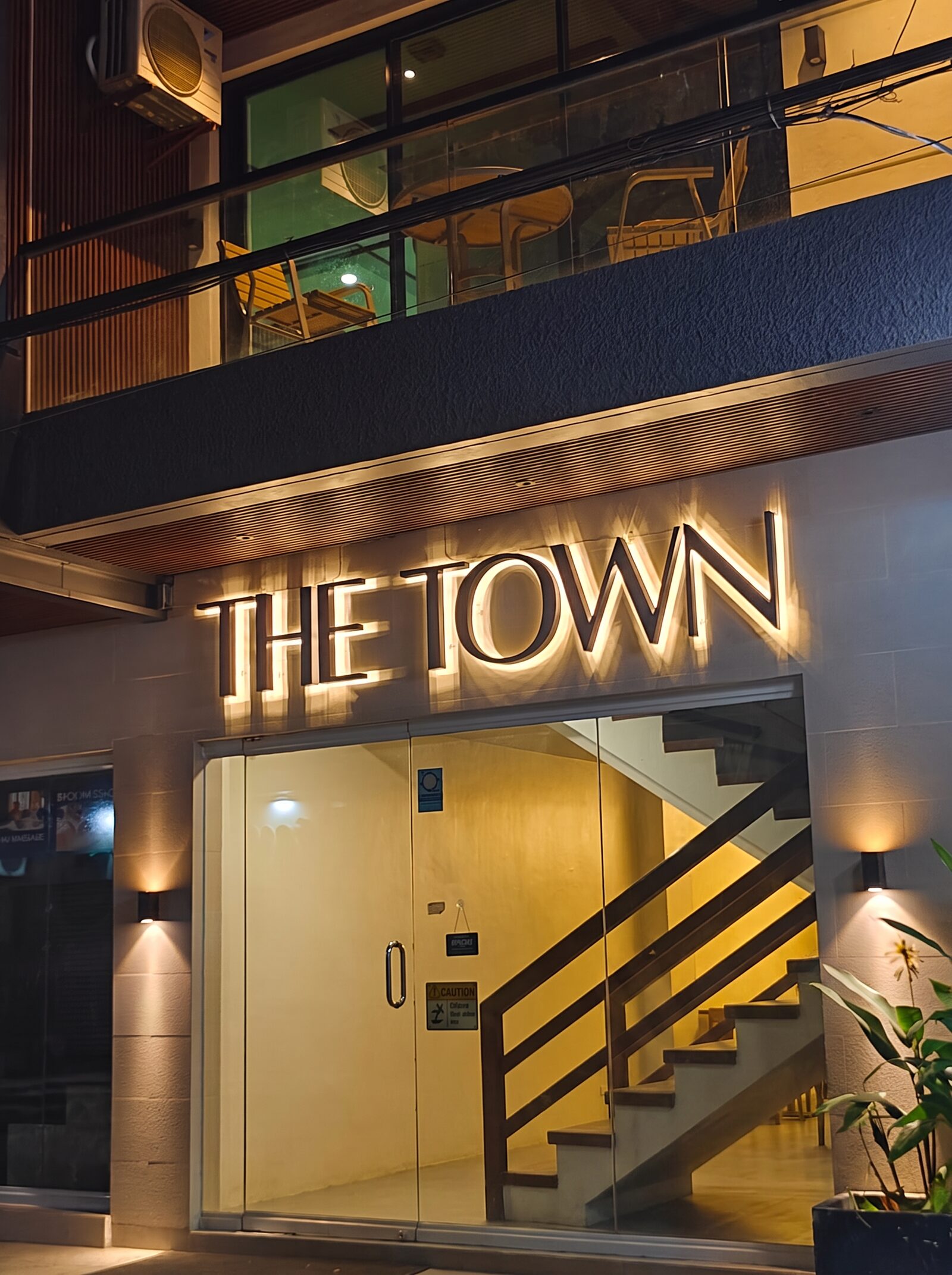 The Town boutique hotel facade on Hama Street at night