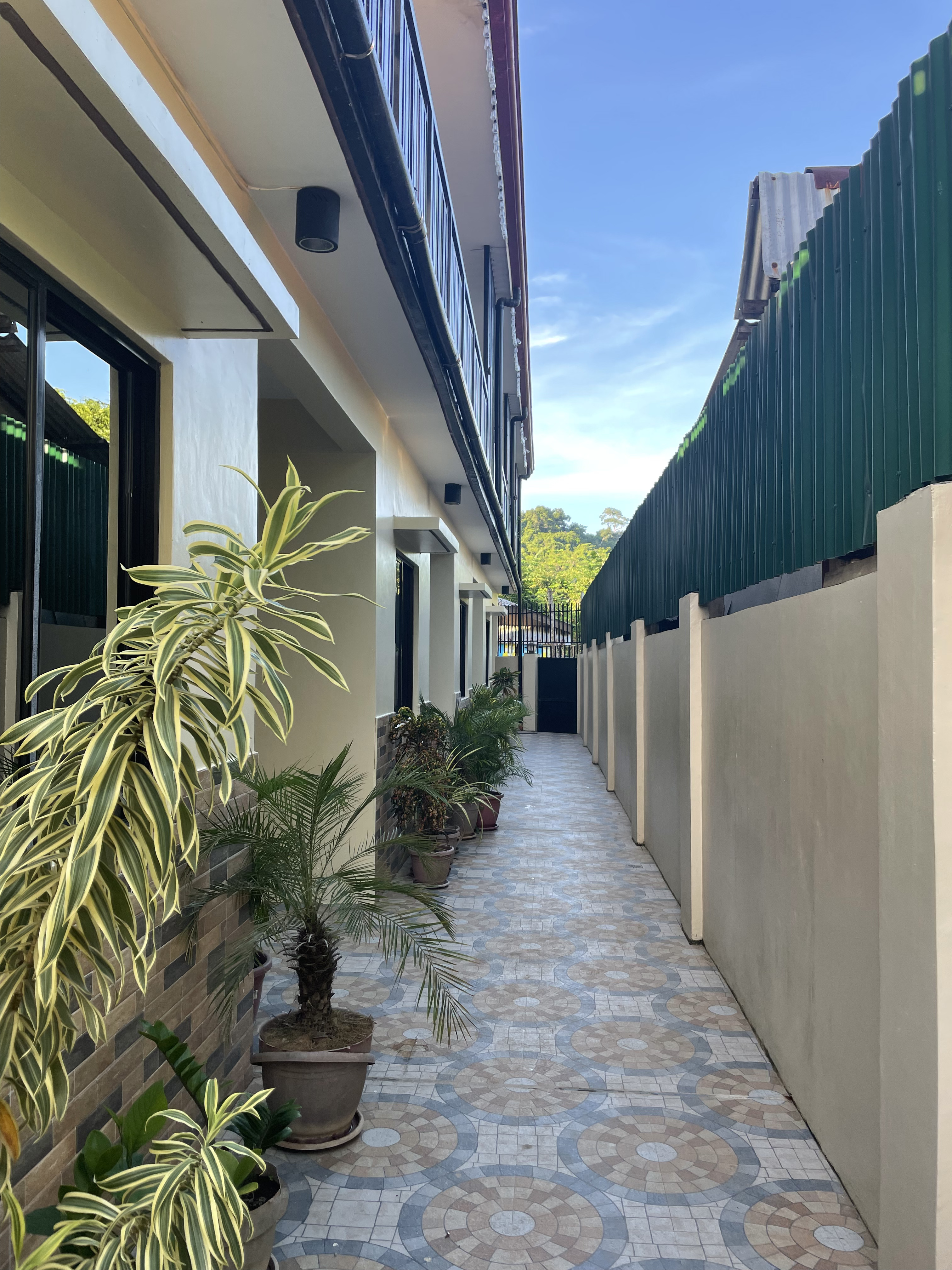 Namal Apartelle residences in El Nido at golden hour